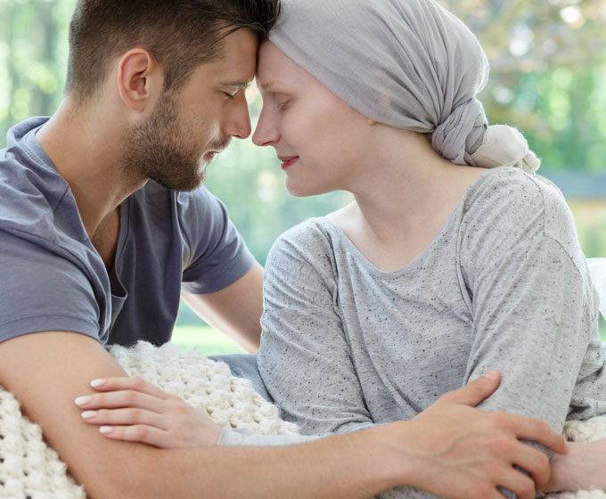 Supportive spouse providing comfort to loved one